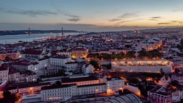 Day to Night Hyperlapse of Residential Buildings and Tourist Landmarks in Lisbon City Center with