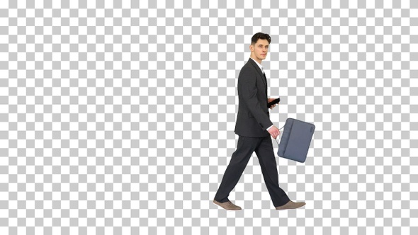 Handsome suspicious businessman walking, Alpha Channel