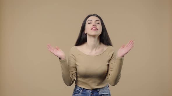 Portrait of a Model with Natural Beauty Clapping Her Hands with Wow Happy Joy and Delight