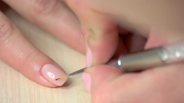 The Process of Making Delicate Design on Nails.