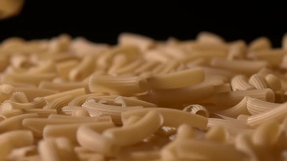 Falling Down Italian Pasta, on Black, Rotation, Close Up, Slow Motion