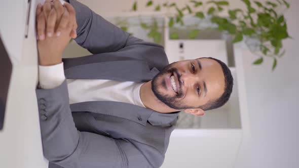 Webcam View of a Video Conference of a Smiling Happy