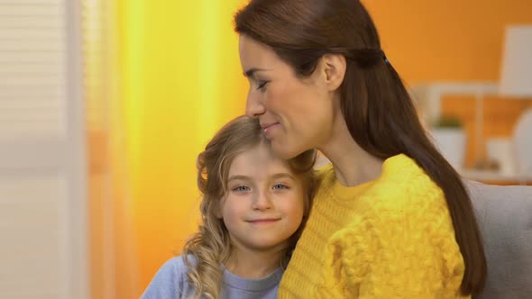 Attractive Happy Lady Hugging Smiling Girl Both Looking to Camera, Advertisement