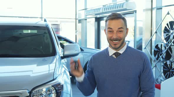 An Incredibly Happy Buyer Holds the Keys To a New Car