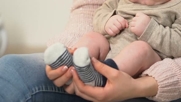 Lady Holding Baby Boy on Lap, Vaginal Birth and Natural Motherhood, Patronage