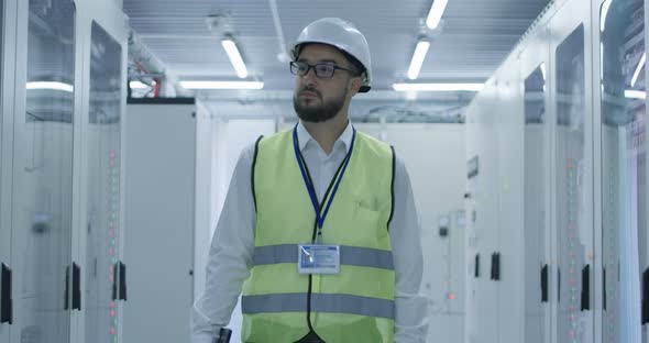 Electrical Worker Walking Down the Hallway