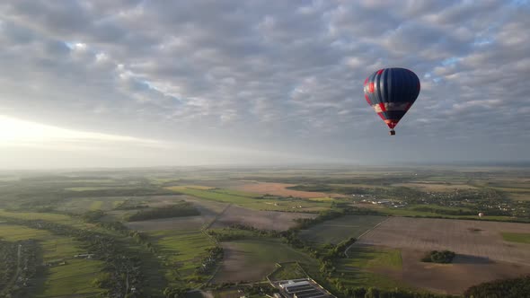 Flight of Hot Air Balloon Aerial Drone View at Dawn