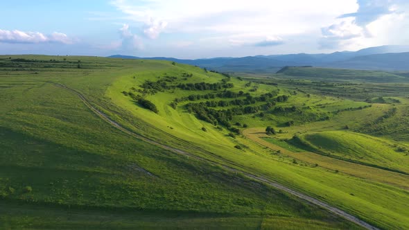 Aerial View of Countryside Vibrant Green Hills. Transylvania, Romania