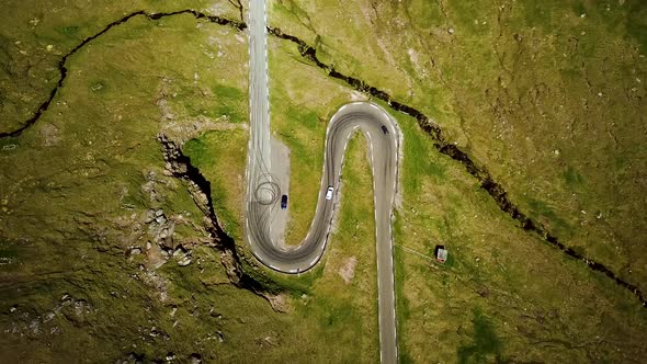 Aerial View of a Winding Road Scenic Road Two Car Arriving in the Same Time