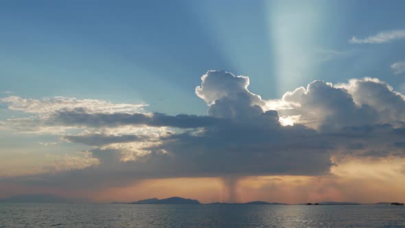 Sunset in Mesologgi Greece. Boat view of the sunset behind clouds and sea horizon.