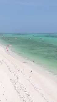 Vertical Video Kitesurfing Near the Shore of Zanzibar Tanzania