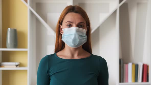 Portrait of a Young Woman with Mask at Home .Concept of Health 