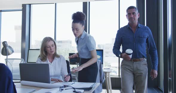 Two women working on computer