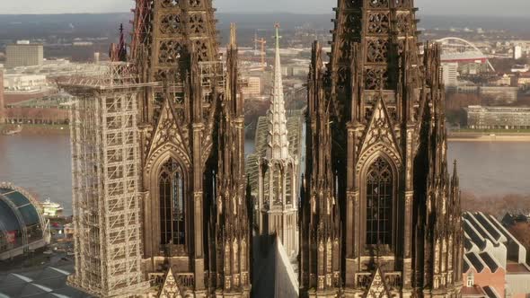 AERIAL: Close Up of Cologne Cathedral Two Brown Towers in Beautiful Sunlight 