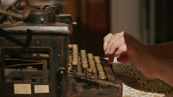 Hands Writing on Old Typewriter Over Wooden Table Background