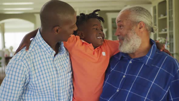 Portrait of a senior African American man, his son and grandson.