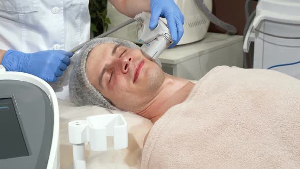 Handsome Man Getting Rejuvenating Procedure at Cosmetology Clinic