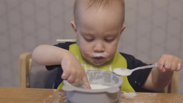 Funny Baby Toddler Learning to Eat with Spoon Child Learn Eating Use Teaspoon