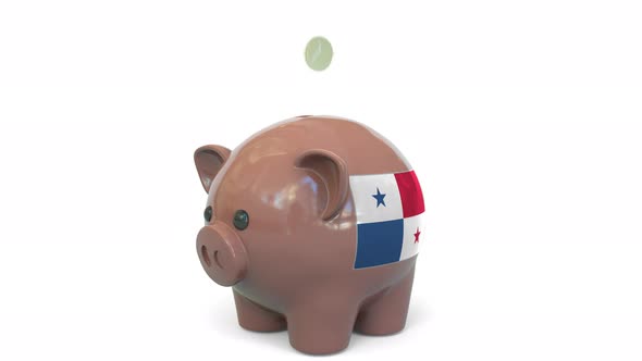 Putting Money Into Piggy Bank with Flag of Panama