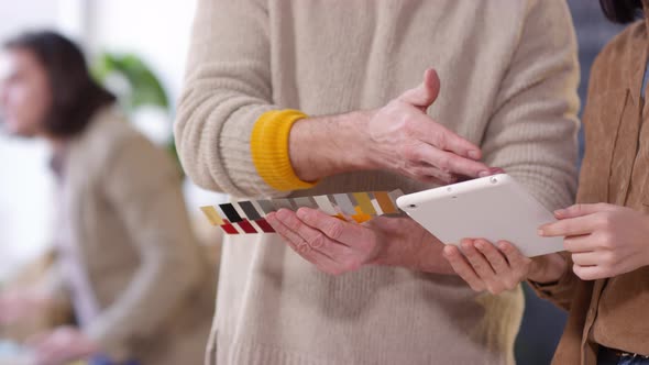 Unrecognizable Man and Woman Discussing Project