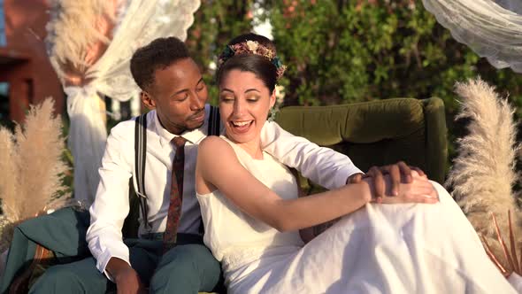 Loving newlywed couple embracing in garden