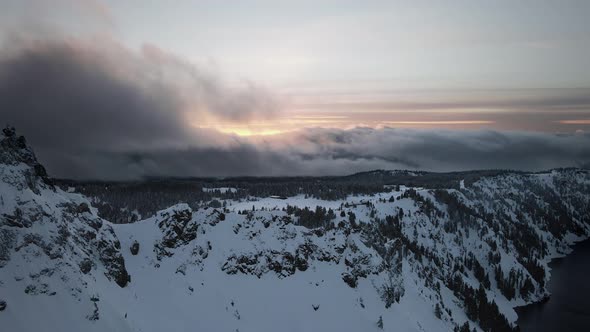 Drone footage of mountains and cliffs on the shore of Crater Lake, Oregon, USA