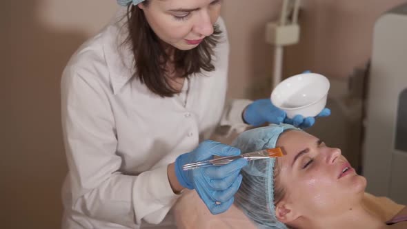 Applying Facial Mask at Woman Face at Beauty Salon