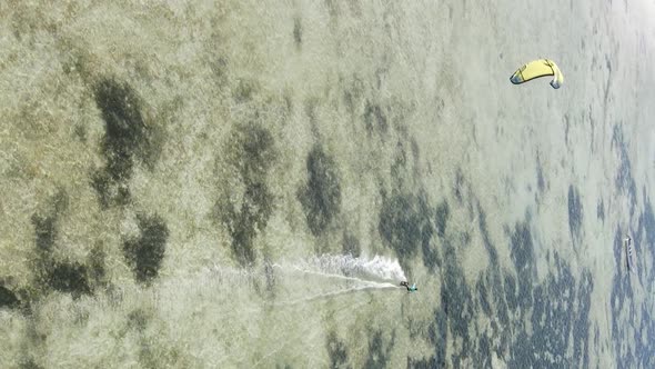 Zanzibar Tanzania  Vertical Video Kitesurfing Near the Shore of Ocean Slow Motion