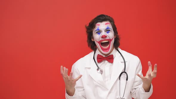 A Clown Doctor with Colorful Makeup Has Fun an Artistic Harlequin Nurse Plays a Show Works with