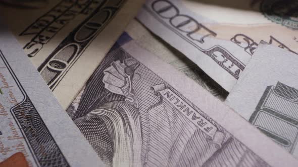 Panning over money viewing 100 dollar bills