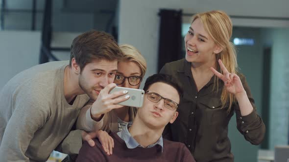 Smiling Business People Taking Selfie in Meeting Room at Creative Office