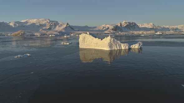 Iceberg Melt in Clear Ocean Drone Aerial View