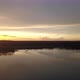 Hovering Over a Large and Big Lake at Sunset - VideoHive Item for Sale