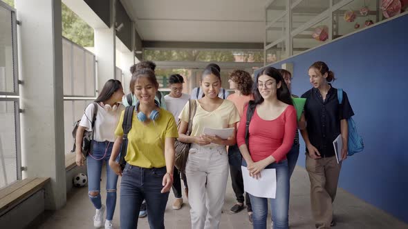 A Group of Students Walk to the Classroom to Begin Classes