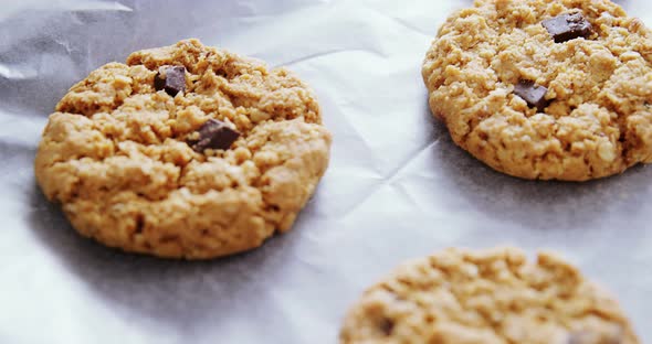 Freshly baked cookies on wax paper 4k