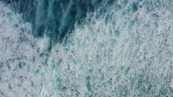 Slow Motion Top Down Aerial View of the Ocean Giant Waves, Foaming and Splashing