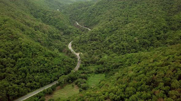 Aerial View Of Countryside Road Passing Through The Mountain Landscape 09