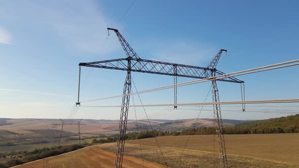 High Voltage Tower with Electric Power Lines Transfening Electrical Energy Through Cable Wires
