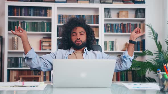 Successful Arabian Man Office Worker Calms Himself Meditation in Office