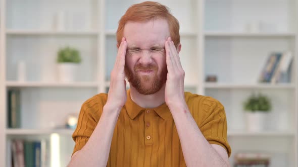 Portrait of Exhausted Redhead Man Having Headache