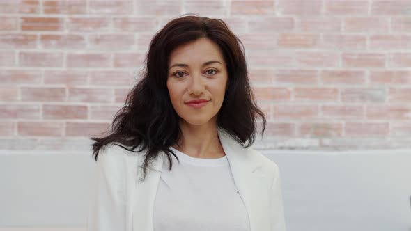 Portrait of a Smiling 45 Year Old Spanish Woman Looking at Camera