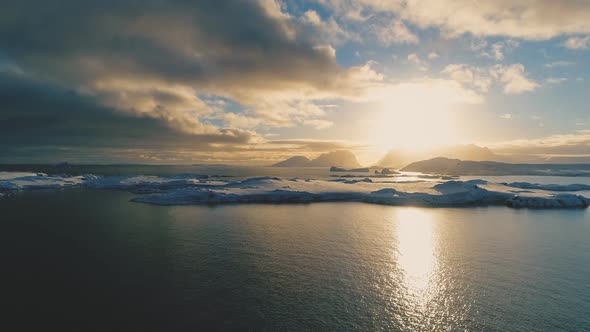 Sunset Above Antarctica Snow Island Aerial Front View