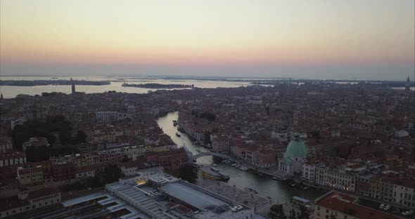 Wide aerial shot of Venice and Scalzi bridge from above at dusk