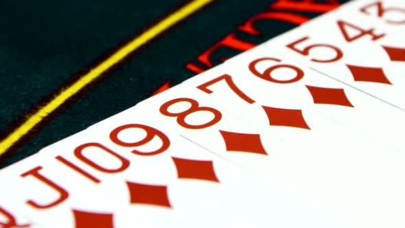 Playing Cards Are Lay Out on Green Poker Table, Closeup