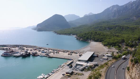 Beautiful Aerial View of Road Through Mountains with Ocean in the Background