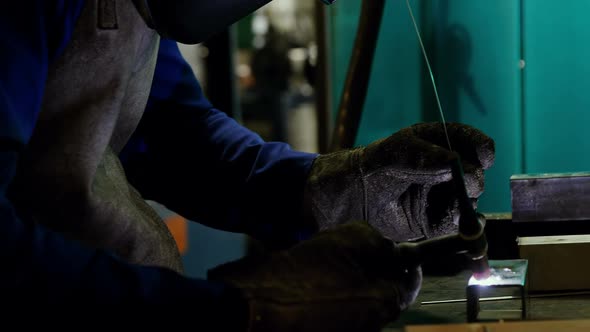 Male welder working on a piece of metal