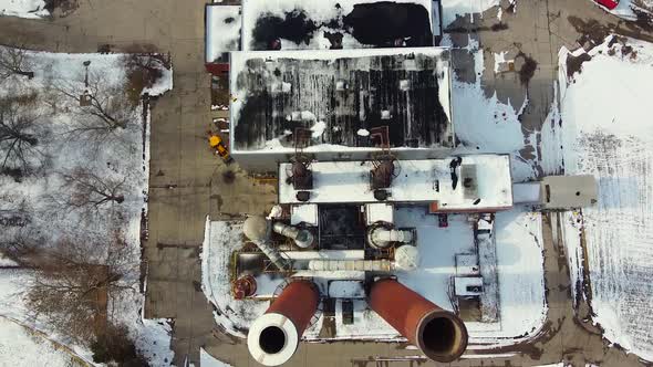 Industrial building with funnel above Madison Heights Michigan