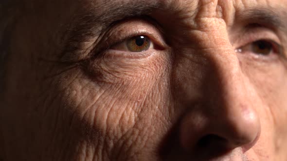 One Eye of the Elderly Man Looks to the Side