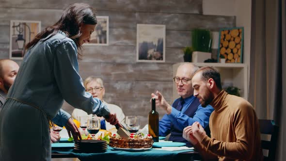 Caucasian Woman Slicing the Cake for Her Birthday