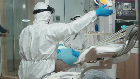 Woman at Dentist While Treatment Process in Coronavirus Pandemic